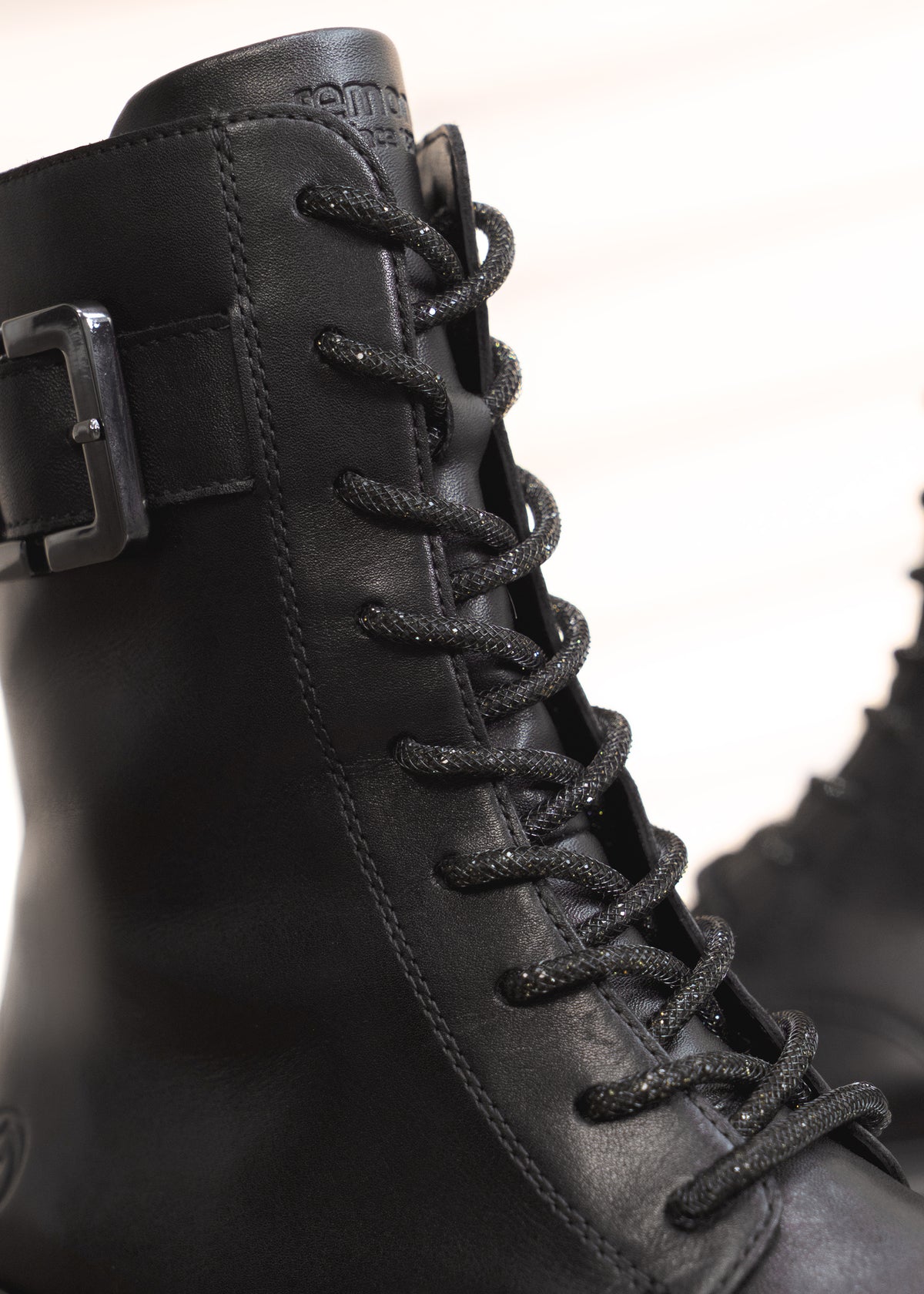 Ankle boots - black leather, buckle decoration on the shaft, sparkling laces