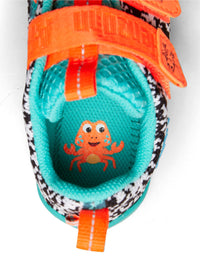 Lasten Crab-paljasjalkatennarit - Sneaker Knit Happy, musta-valkoinen neulos, vihreä pohja, oranssit tarrat